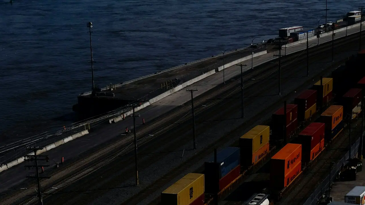 Cargo containers, trains, and trucks at an international port