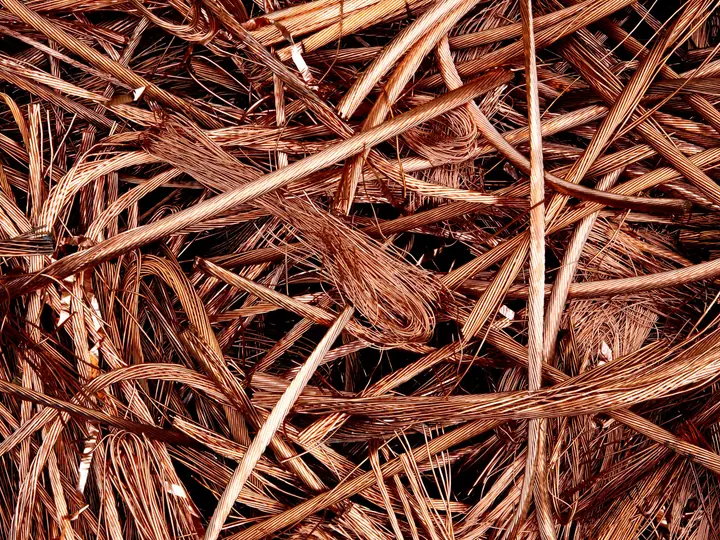 A dense mass of bare bright copper wire prepared for recycling