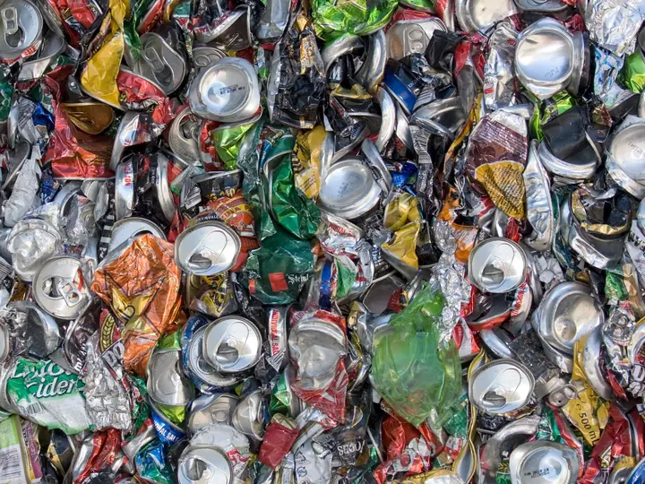 Close-up of crushed aluminium cans prepared for recycling